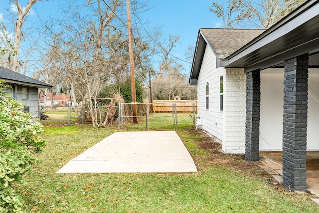 view of yard with a patio and fence