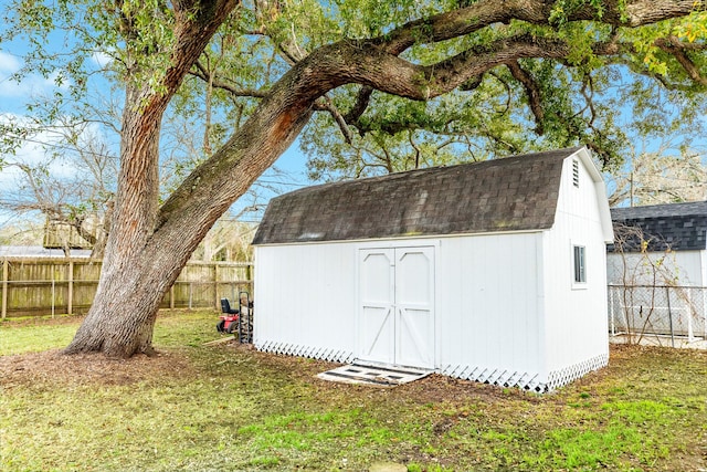 view of shed featuring a fenced backyard