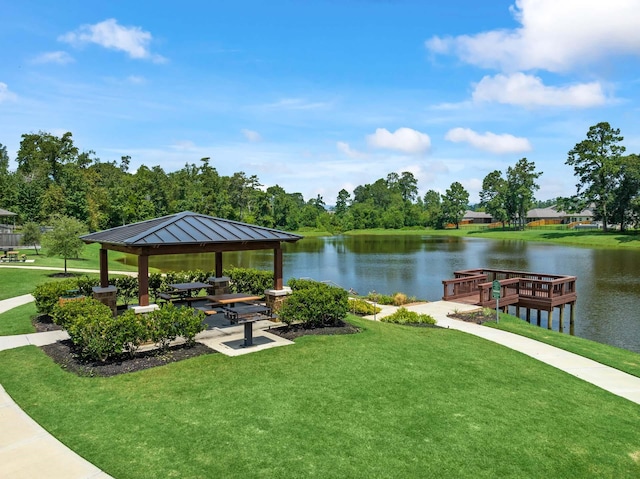 view of home's community with a yard, a water view, and a gazebo