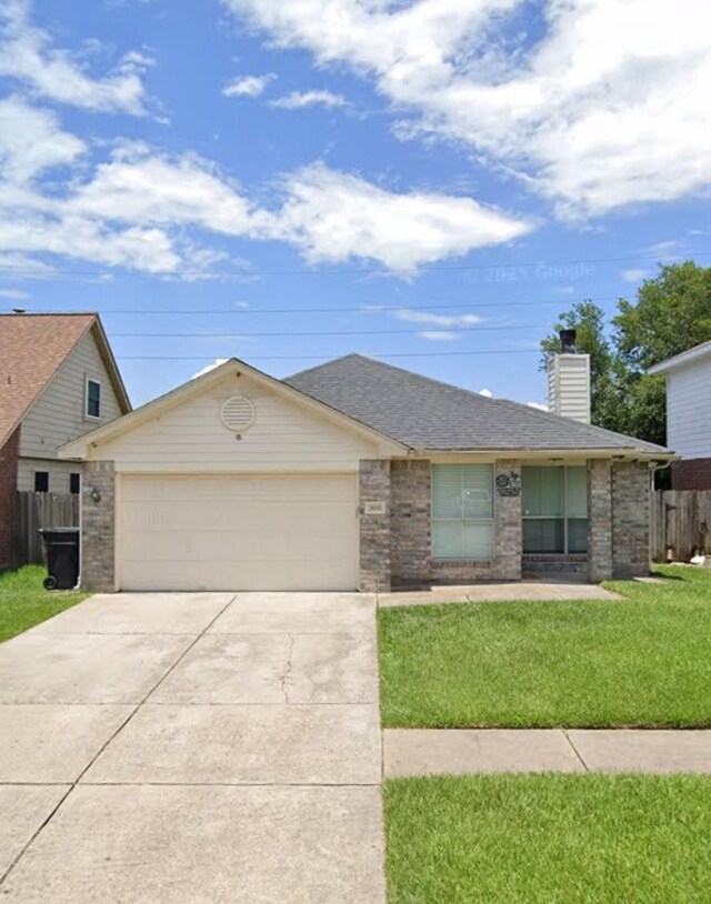 ranch-style house featuring a front lawn, fence, a chimney, an attached garage, and driveway