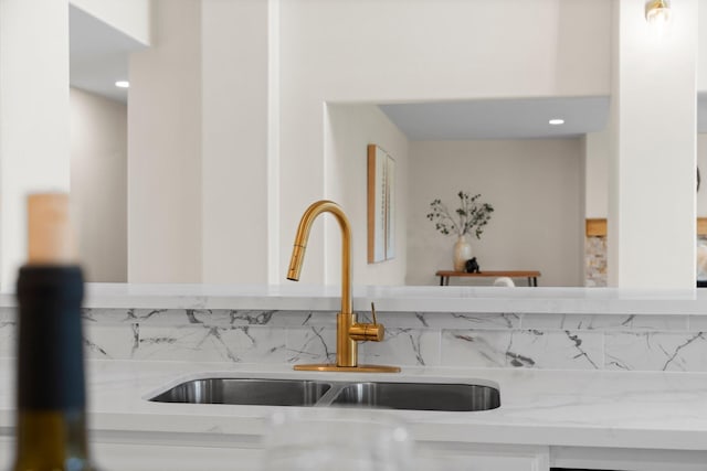 14206 Barker Bayou Ct, Cypress, TX 77429 - kitchen view of a sink and light stone counters