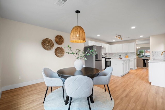 14206 Barker Bayou Ct, Cypress, TX 77429 - dining space with light wood-style floors, baseboards, and recessed lighting