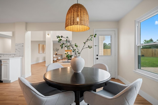 14206 Barker Bayou Ct, Cypress, TX 77429 - dining area featuring light wood-type flooring and baseboards