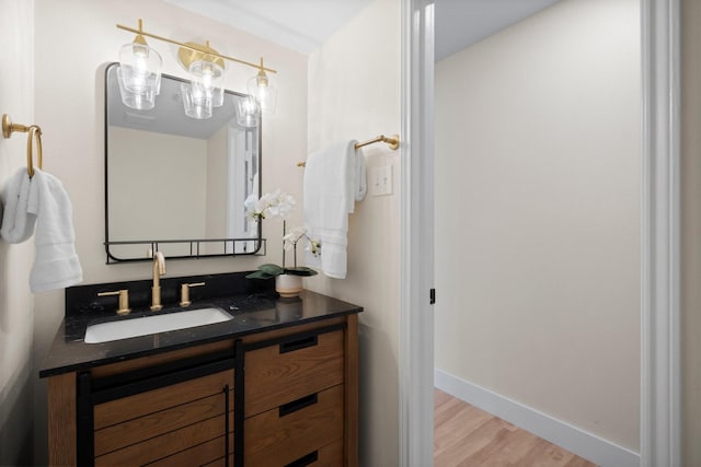 14206 Barker Bayou Ct, Cypress, TX 77429 - bathroom with wood finished floors, vanity, and baseboards