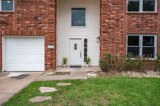 14206 Barker Bayou Ct, Cypress, TX 77429 - doorway to property featuring brick siding, driveway, and a yard
