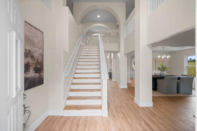 14206 Barker Bayou Ct, Cypress, TX 77429 - entryway featuring a high ceiling, wood finished floors, baseboards, and stairway