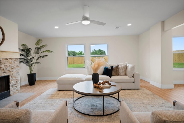 14206 Barker Bayou Ct, Cypress, TX 77429 - living room with light wood-style floors, healthy amount of natural light, ceiling fan, and recessed lighting
