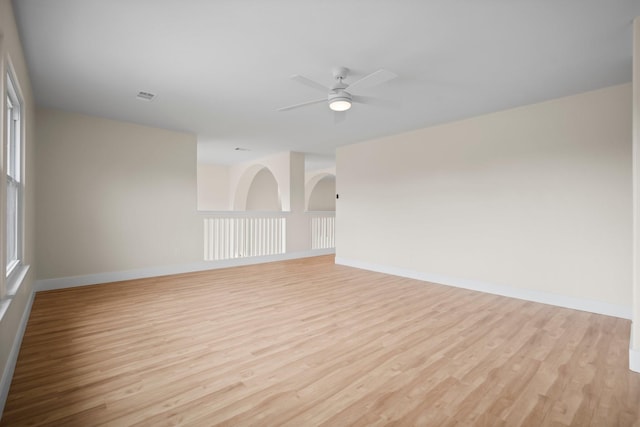 14206 Barker Bayou Ct, Cypress, TX 77429 - unfurnished room featuring light wood-type flooring, a ceiling fan, and baseboards