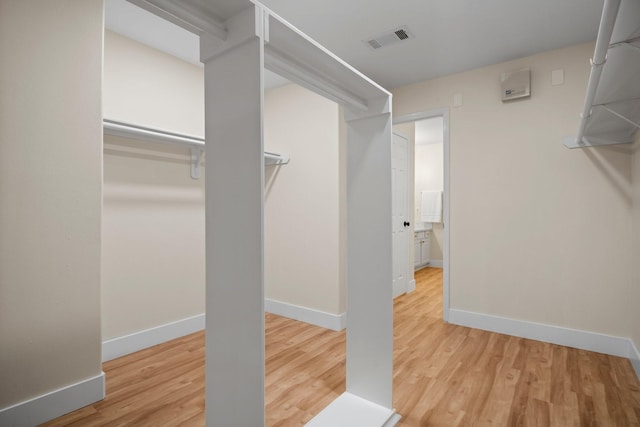 14206 Barker Bayou Ct, Cypress, TX 77429 - spacious closet with wood finished floors