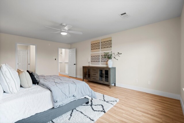 14206 Barker Bayou Ct, Cypress, TX 77429 - bedroom featuring baseboards, light wood-style floors, and a ceiling fan