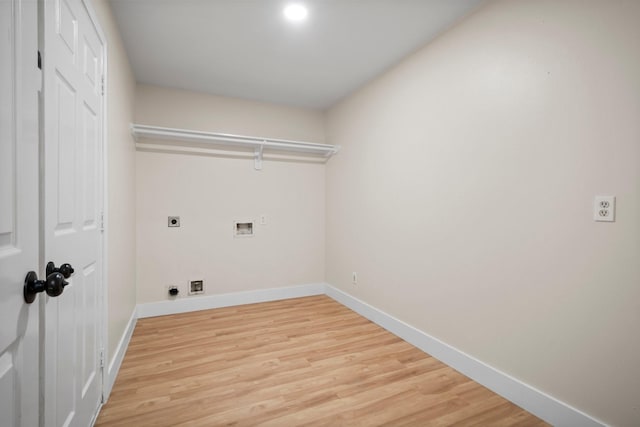 14206 Barker Bayou Ct, Cypress, TX 77429 - laundry room featuring hookup for an electric dryer, light wood-type flooring, hookup for a washing machine, and baseboards