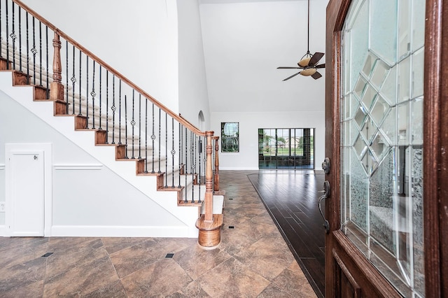 4703 Shadow Grass Dr, Katy, TX 77493 - foyer featuring high vaulted ceiling, baseboards, a ceiling fan, stairway, and stone finish flooring