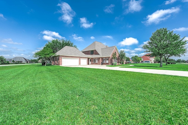 4703 Shadow Grass Dr, Katy, TX 77493 - view of front of house with an attached garage, brick siding, driveway, and a front lawn