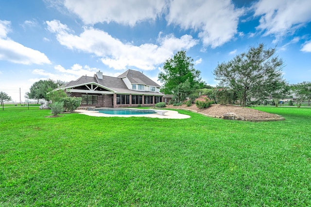 4703 Shadow Grass Dr, Katy, TX 77493 - view of green lawn featuring an outdoor pool and a patio area