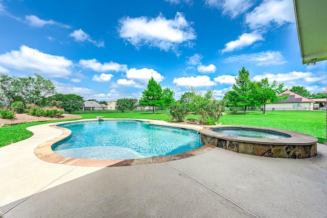 4703 Shadow Grass Dr, Katy, TX 77493 - view of pool featuring a patio area, a lawn, and a pool with connected hot tub