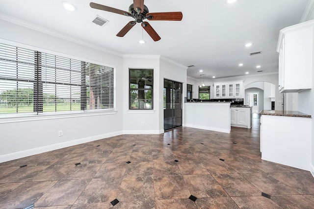 4703 Shadow Grass Dr, Katy, TX 77493 - unfurnished living room featuring ceiling fan, arched walkways, recessed lighting, baseboards, and ornamental molding