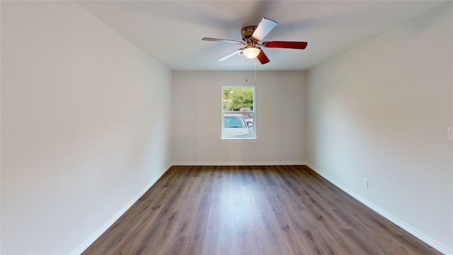 1002 Francis Dr, Pasadena, TX 77506 - spare room featuring wood finished floors, ceiling fan, and baseboards