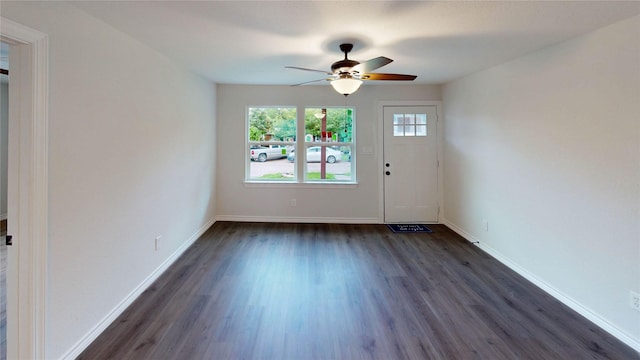 1002 Francis Dr, Pasadena, TX 77506 - foyer entrance featuring dark wood-type flooring, ceiling fan, and baseboards