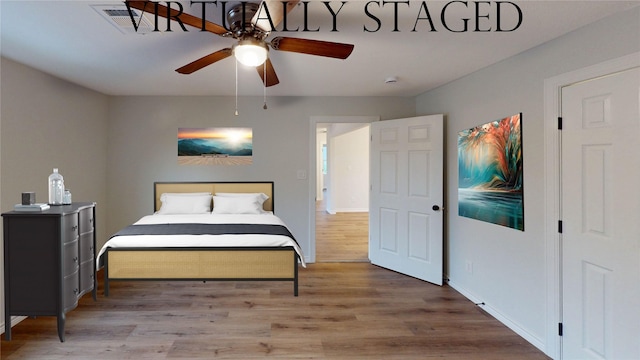 1002 Francis Dr, Pasadena, TX 77506 - bedroom featuring wood finished floors, baseboards, and a ceiling fan
