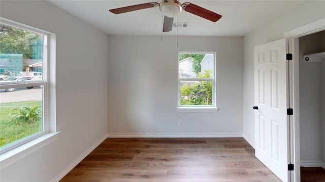 1002 Francis Dr, Pasadena, TX 77506 - empty room with wood finished floors, ceiling fan, and baseboards