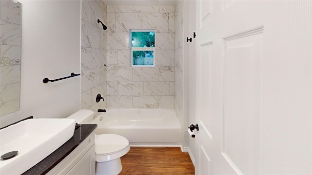1002 Francis Dr, Pasadena, TX 77506 - full bath featuring toilet, tub / shower combination, wood finished floors, and vanity
