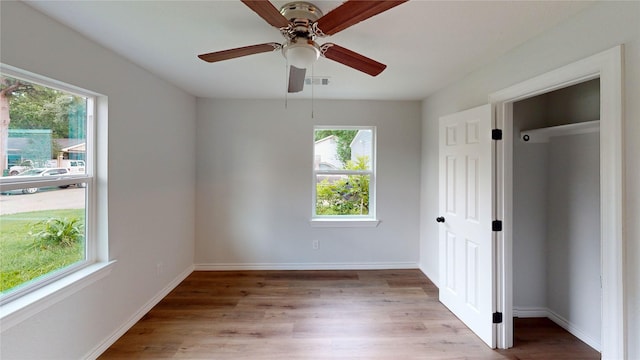1002 Francis Dr, Pasadena, TX 77506 - unfurnished bedroom with light wood-style flooring, baseboards, and ceiling fan