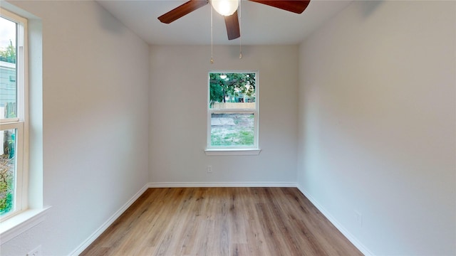 1002 Francis Dr, Pasadena, TX 77506 - empty room with light wood finished floors, ceiling fan, and baseboards