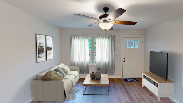 1002 Francis Dr, Pasadena, TX 77506 - living room featuring a ceiling fan, wood finished floors, and baseboards