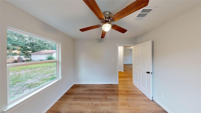 1002 Francis Dr, Pasadena, TX 77506 - spare room featuring plenty of natural light, light wood finished floors, baseboards, and ceiling fan