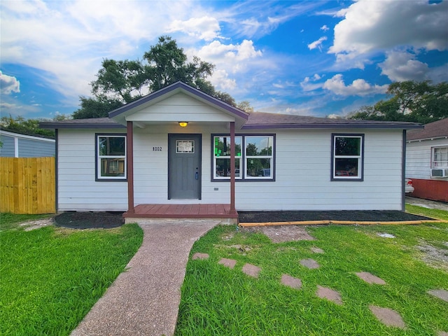 1002 Francis Dr, Pasadena, TX 77506 - single story home with a porch and cooling unit