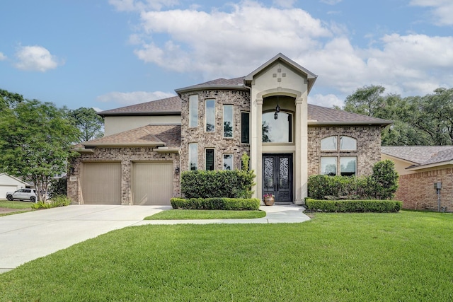 view of front of property featuring roof with shingles, an attached garage, a front lawn, brick siding, and driveway