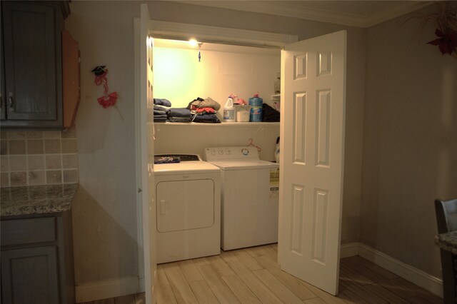 laundry room with laundry area, baseboards, separate washer and dryer, ornamental molding, and light wood-style flooring