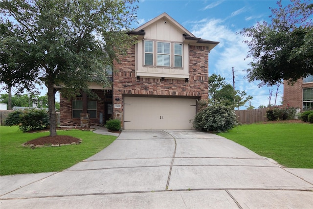 view of front of property with brick siding, an attached garage, driveway, and a front yard