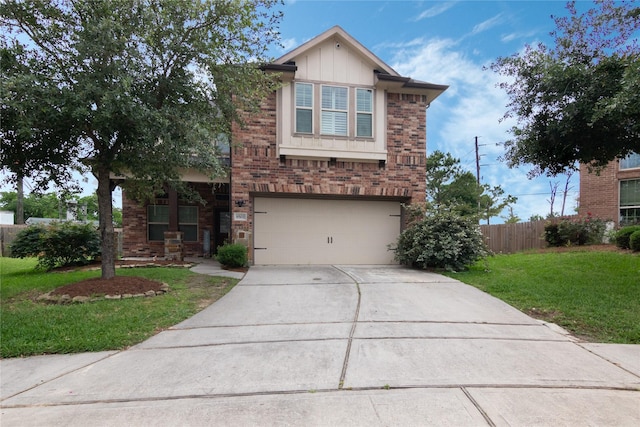 view of front of house featuring a front yard, brick siding, fence, concrete driveway, and an attached garage