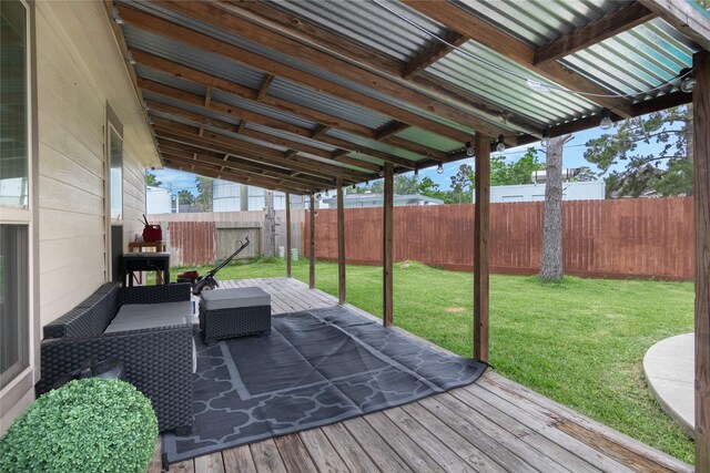 wooden deck with a fenced backyard and a yard