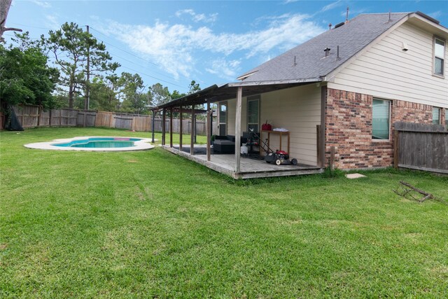 view of yard featuring a fenced backyard, a fenced in pool, and a patio area