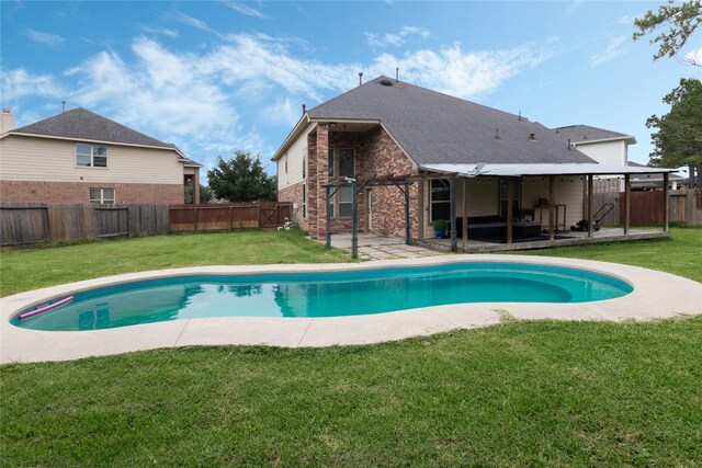 view of pool with a yard, a patio, a fenced in pool, and a fenced backyard