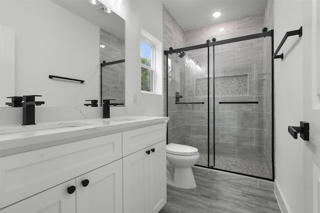 bathroom featuring a sink and a shower stall
