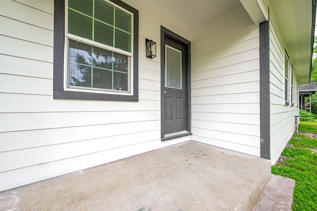 doorway to property featuring covered porch