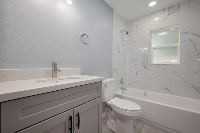 full bathroom with toilet, shower / bathing tub combination, and vanity