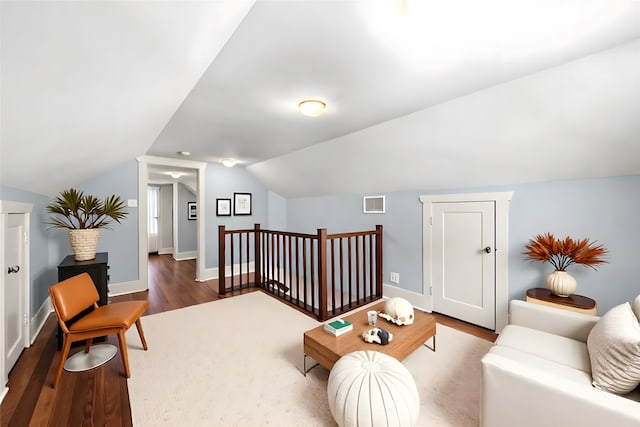 401 Omar St, Houston, TX 77009 - living room with wood finished floors, vaulted ceiling, and baseboards
