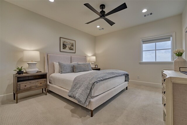 bedroom with visible vents, recessed lighting, baseboards, and light carpet