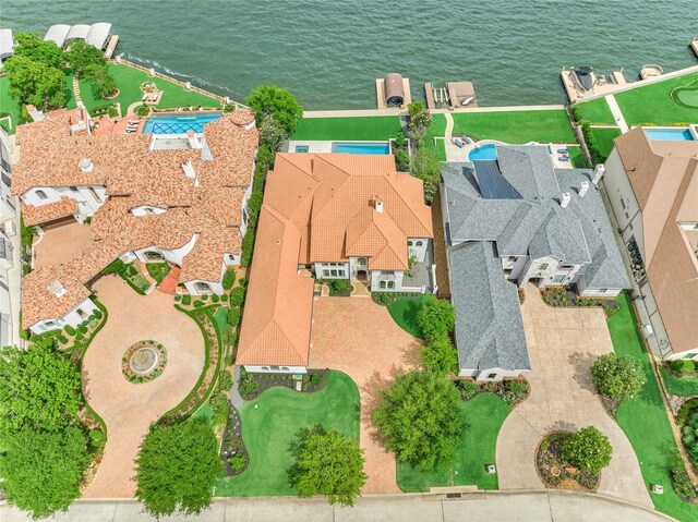 birds eye view of property featuring a residential view and a water view