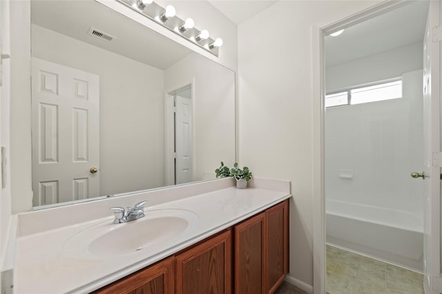 full bathroom featuring vanity and visible vents