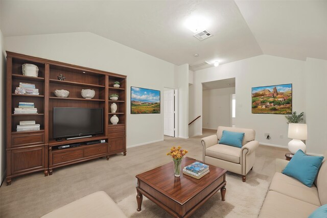 living area featuring baseboards, visible vents, light carpet, and lofted ceiling
