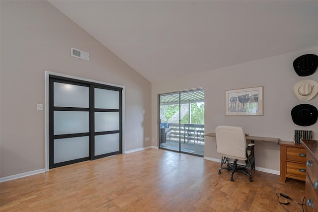 182 April Point Dr N, Conroe, TX 77356 - office area with visible vents, baseboards, wood finished floors, and high vaulted ceiling