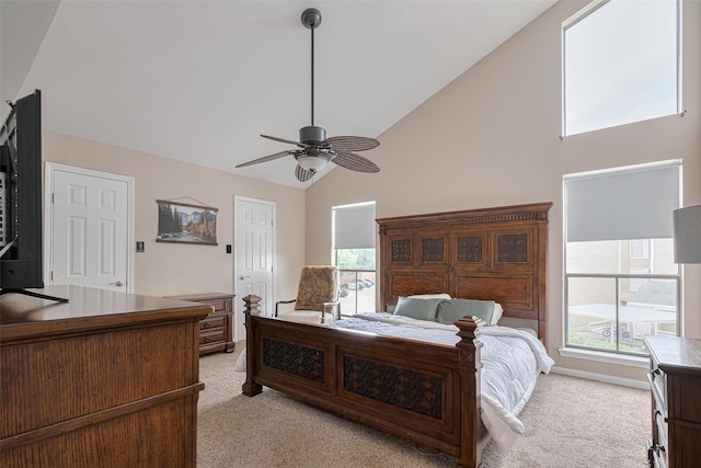182 April Point Dr N, Conroe, TX 77356 - bedroom with high vaulted ceiling, ceiling fan, and light carpet