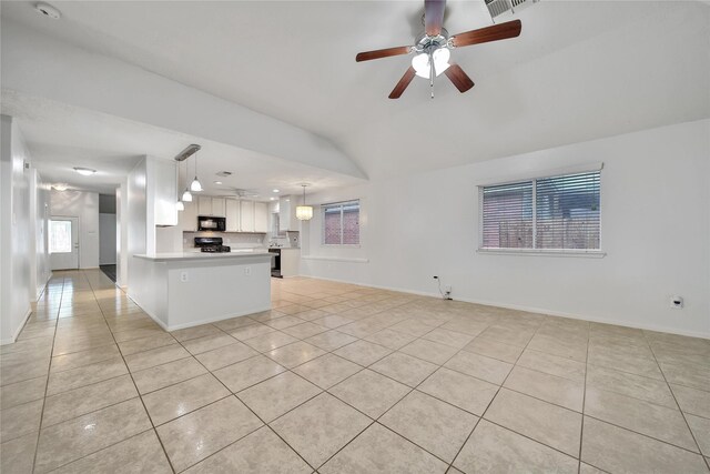 unfurnished living room featuring light tile patterned flooring, ceiling fan, visible vents, and baseboards