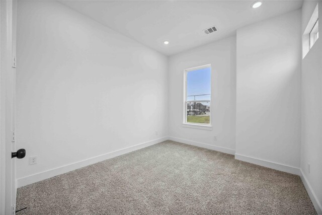 unfurnished room featuring baseboards, carpet, recessed lighting, and visible vents