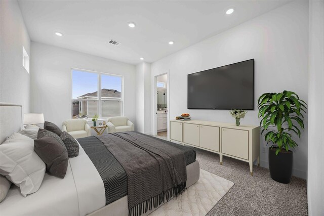 bedroom with light colored carpet, visible vents, and recessed lighting